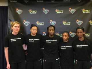 Members of the New York Liberty wear T-shirts expressing solidarity with #BlackLivesMatter and the #Dallas5 after a game against the San Antonio Stars July 10, 2016.
